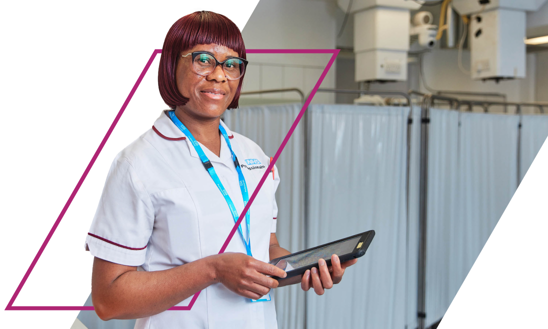 A standing nurse in uniform holding a tablet.